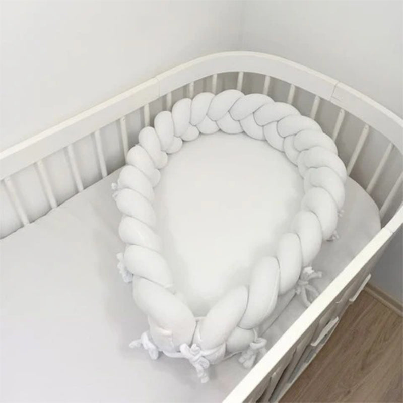 Réducteur de lit bébé tressés