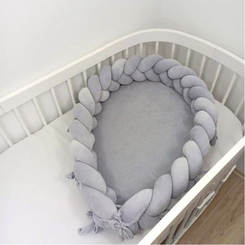 Réducteur de lit bébé tressés
