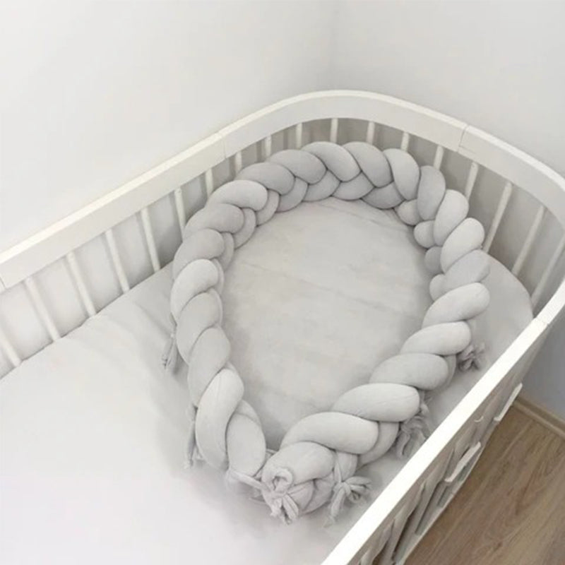 Réducteur de lit bébé tressés