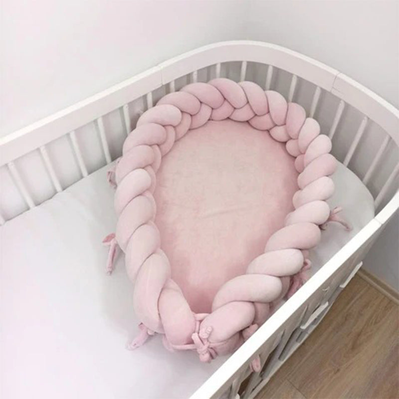 Réducteur de lit bébé tressés
